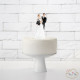 NEWLYWEDS WITH A CLAPPERBOARD CAKE TOPPER